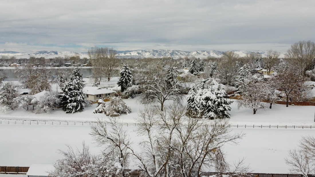 Fort Collins during March 2021 snow storm, facing west overlooking the Power Trail. 